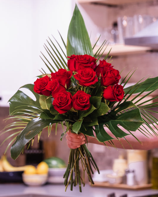 red roses, dozen red roses, tropical greens, monstera leaf, palm leaf, dozen roses, contemporary dozen roses, valentines roses